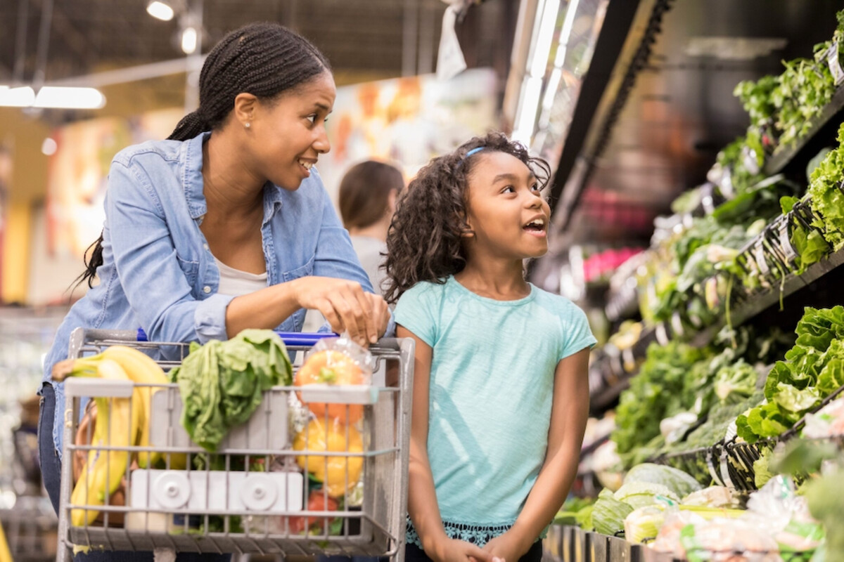Summer P-EBT Benefits Issued to School-Age Children in Virginia Mom and daughter shopping for produce