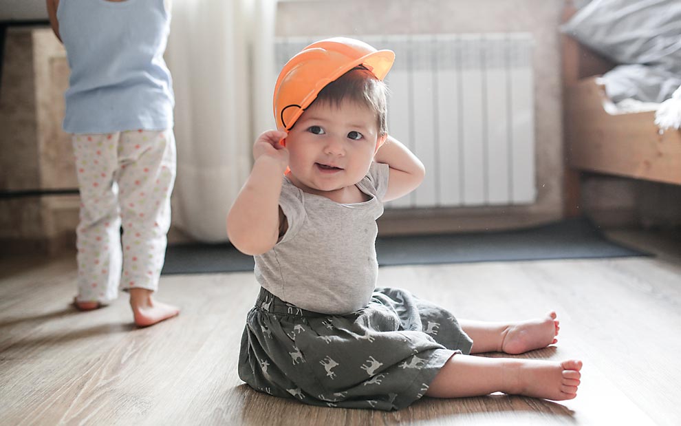 12 Important Tips for Your Baby’s Safety Baby with hard hat