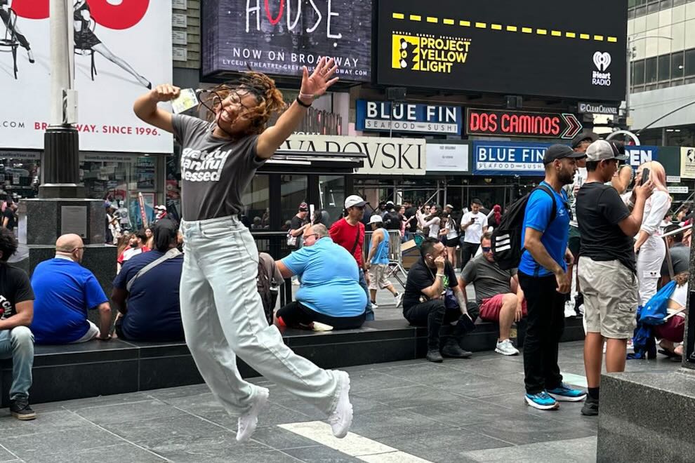 Project Yellow Light and the People and Communities It Benefits Kambria Cook celebrates in Times Square