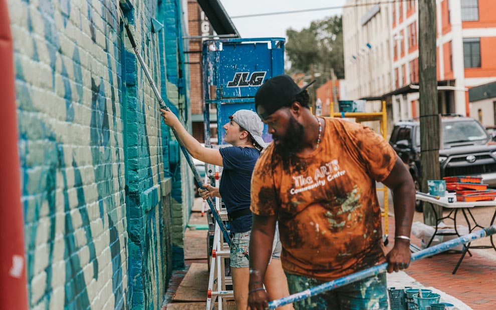 When Art Unites! painting Mending Walls mural