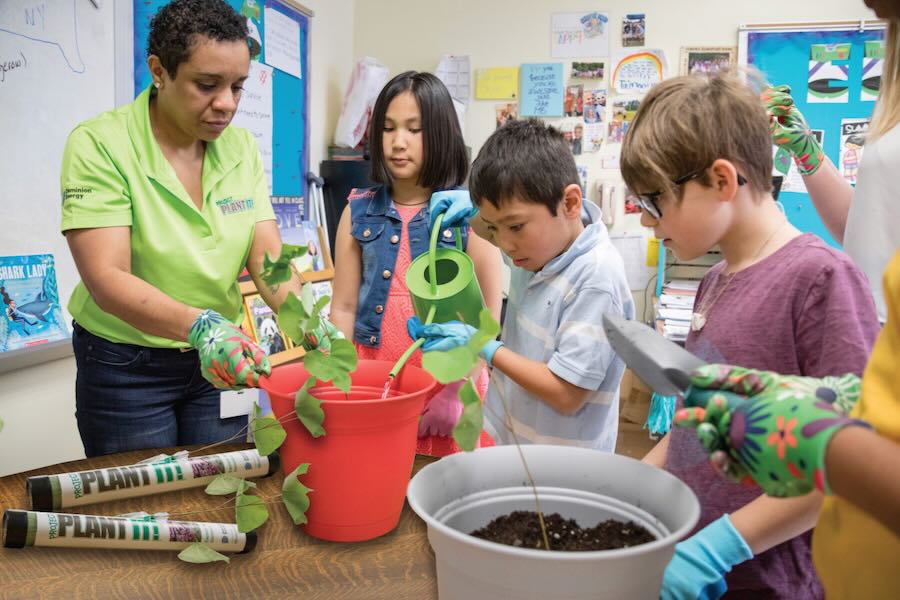 Family Life Can Be Greener students in a classroom learning about trees Project Plant It