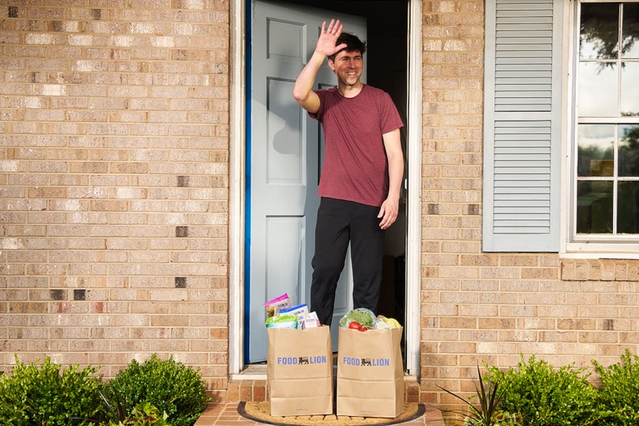 Food Lion Expands Home Delivery in Three States, Including Virginia Man on porch accepting Food Lion delivery