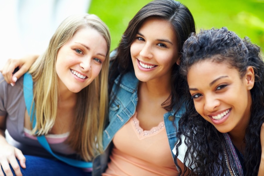 Birth Control: Best Options for Teens Three friends/teen girls acsmiling