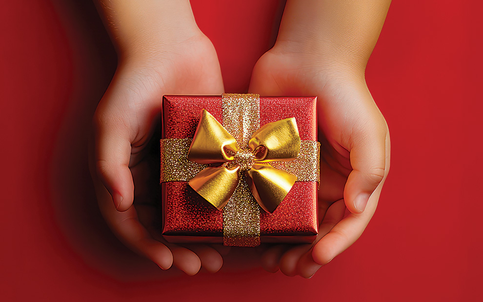 4 Strategies for Holiday Family Spending child holding gift box