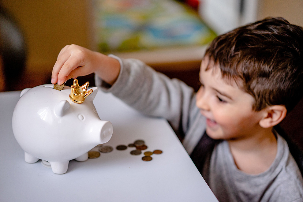 Saving for the Future boy with piggy bank