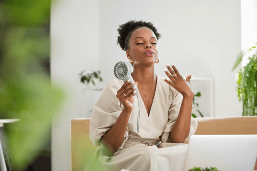4 Benefits of Menopause Hormone Therapy: What You Need to Know woman fanning herself