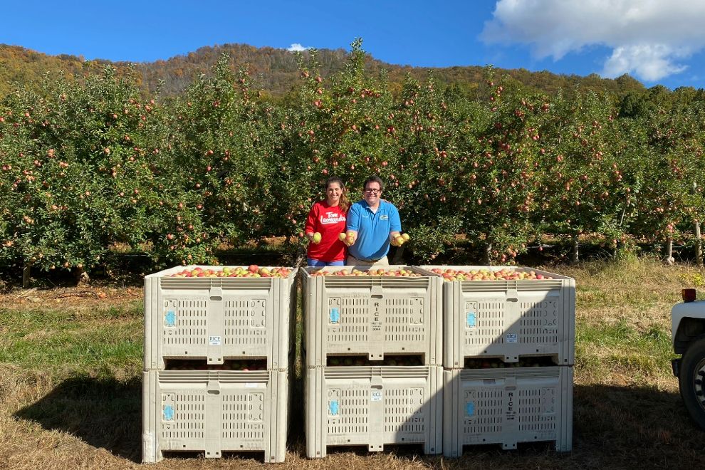 TJ Leonard at an apple orchard - Tom Leonard's Farmer's Market