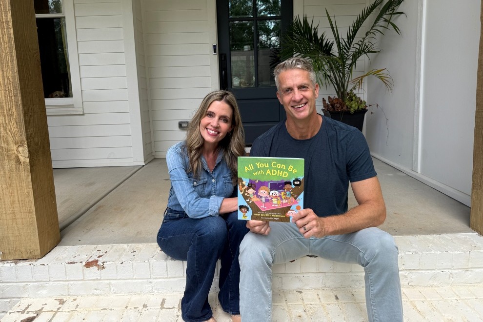 Penn and Kim Holderness holding ADHD Is Awesome book