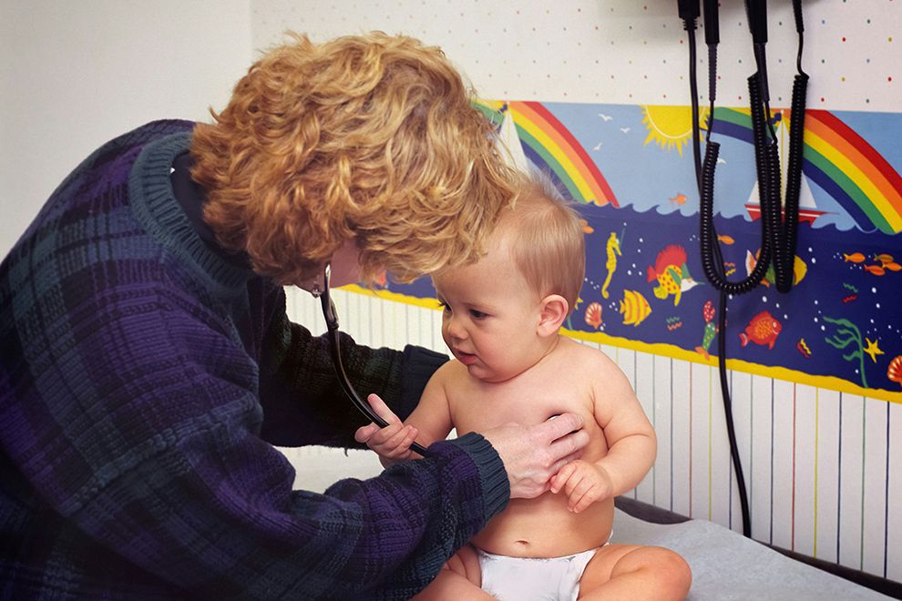 Infant Influenza baby and doctor in doctor's office