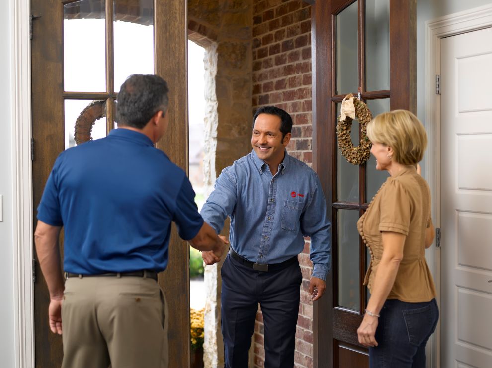 Save on Your Winter Heating Bill Trane Residential technician with homeowners