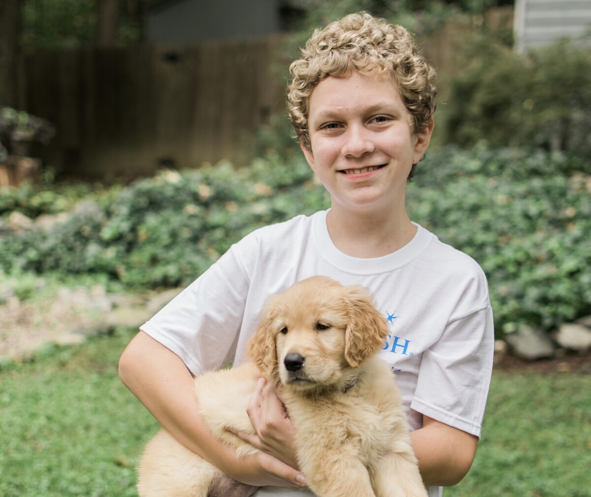 You Don’t Have to Wait to Help Make-A-Wish Lift Up Kids young boy with puppy