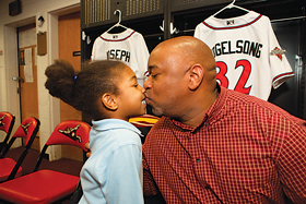 Team dad-and-adopted-daughter enjoy some together time at the Diamond.