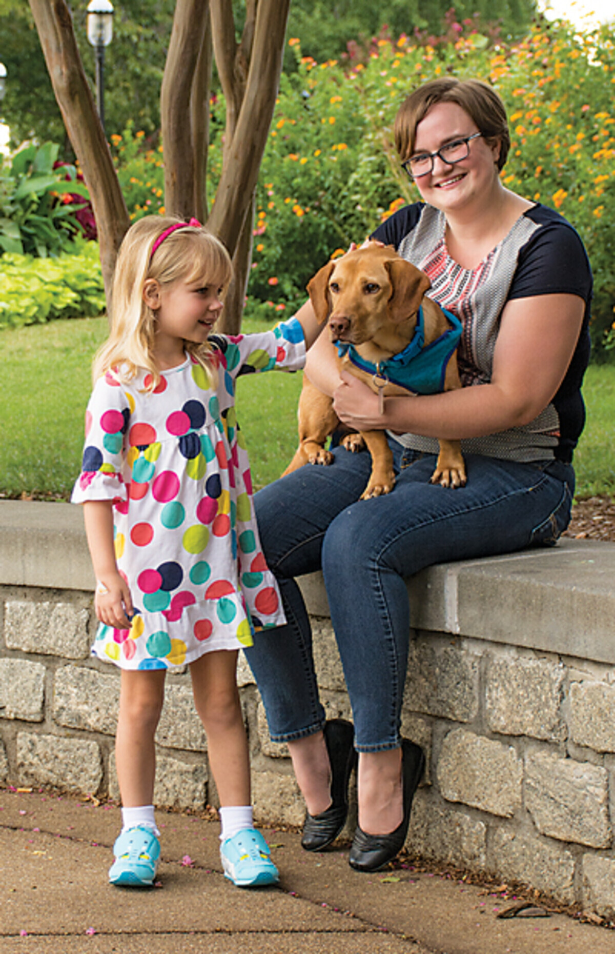 Bucky, on Erin’s lap, makes a new friend in Harper at Libby Hill Park in Church Hill.